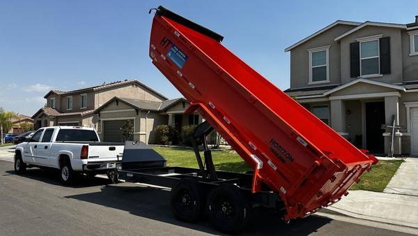 Dumpster delivery truck for Speedy Dumpsters